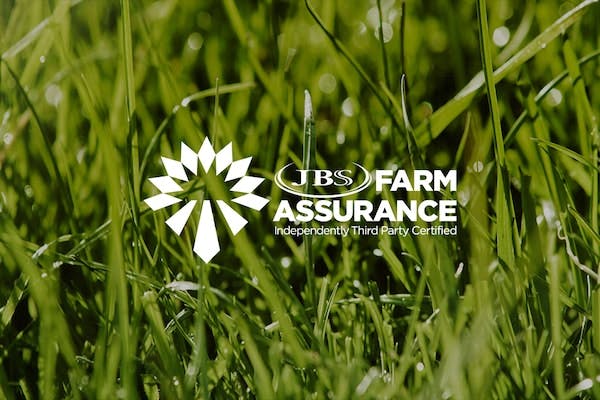 Farm Assurance logo over grass